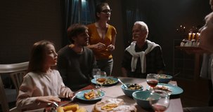 Happy family celebrating birthday. Old moustached man blowing out candles on birthday case while his grown kids and grandchildren are clapping and cheering - real people, celebration concept 4k video