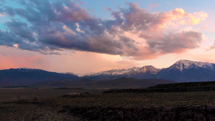 Cinematic aerial shot of sunset sky over Volcanic Tableland in Eastern Sierra, California