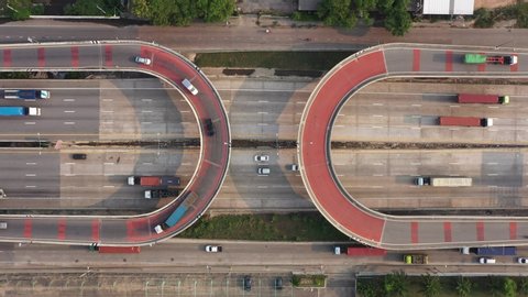 Aerial view of transportation with Expressway, Road and Roundabout, multilevel junction highway in logistic business area -Top view. Car, truck movement Important infrastructure. Transport technology.
