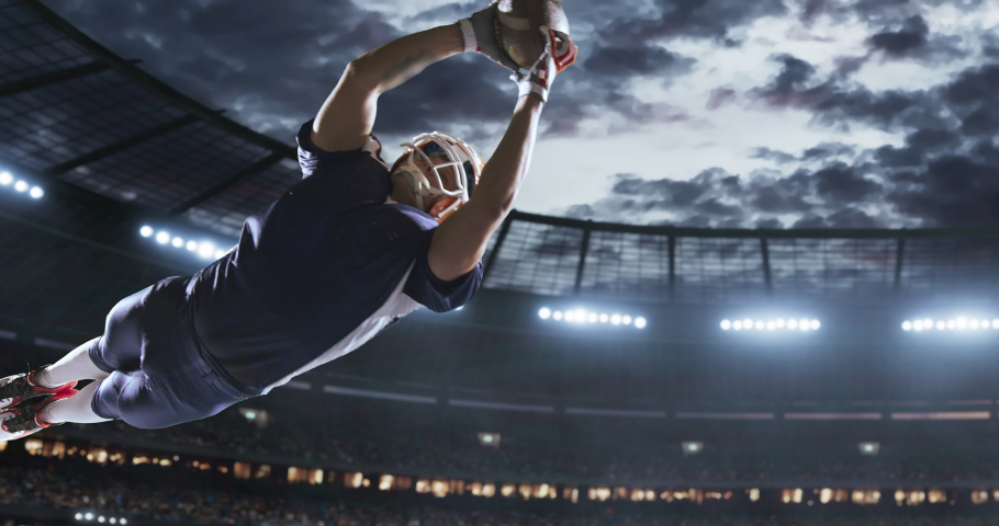 American football player in action on a professional stadium. Stadium is made in 3d with animated crowd.