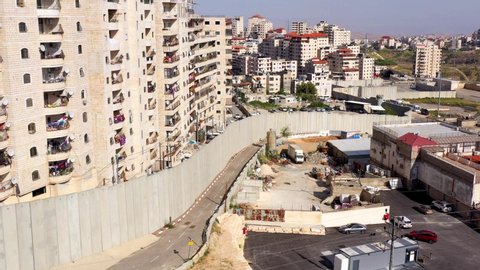 Security wall with Israeli idf watch tower Close to Shuafat Refugee Camp- Aerial Israel, Jerusalem- May/10,2020