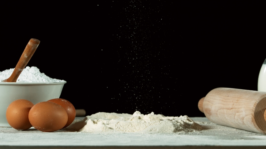 Super slow motion of falling yeast dough into flour. Filmed on high speed cinema camera, 1000 fps. Royalty-Free Stock Footage #1054565894