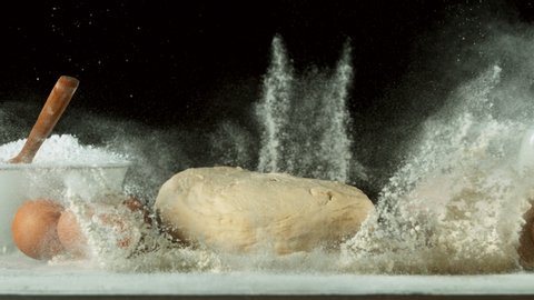 Super slow motion of falling yeast dough into flour. Filmed on high speed cinema camera, 1000 fps.