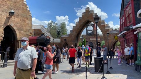 Orlando, FL/USA - 6/13/20:  People walking through Hogsmeade at the Wizarding World of Harry Potter in Universal Studios