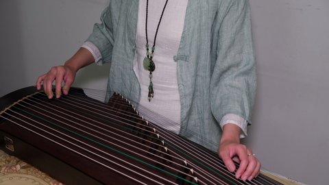  Playing Chinese music instrument Guzheng at home amid coronavirus pandemic