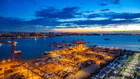 Haikou Port Container Terminal Timelapse during Sunset, The Main Transportation Hub for Hainan Pilot Free Trade Zone and Free Trade Port of China, Asia.