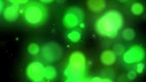 Glowing bokeh in motion design style on dark background. Abstract template with green gradient glowing. Wind floating dynamical round decoration element. 4K Ultra HD 3840x2160 looped animation