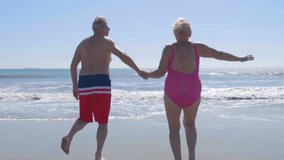 Active Senior Couple Running On The Beach in 4K slow motion 60fps
 - Powered by Shutterstock - Get 15% off with code: PIKWIZARD15