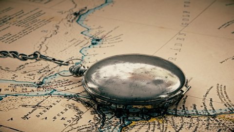 Detailed Old Compass On A Vintage Map. An old-fashioned instrument. Retro style. Adventure stories or Great Geographical discoveries background.