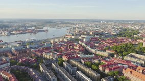 Inscription on video. Gothenburg, Sweden. Panorama of the city and the river Goeta Elv with ships. Sunset. Glitch effect text, Aerial View