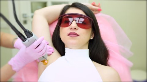 Epilation with   laser in a beauty salon. Hair Removal Procedure.