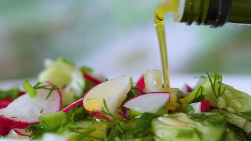 Vegetable Fresh Salad Food Healthy Meal Mediterranean Kitchen Vegetarian Diet Olive Oil. Closeup Pour Olive Oil on Fresh Salad. Close up Healthy Lunch, Colorful Food Onion Cucumber Radish. Slow Motion | Shutterstock HD Video #1054588523