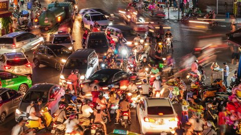 Hanoi, Vietnam - July 04: Timelapse view of rush hour traffic on busy intersection in Hanoi Hoan Kiem district aka Old Quarter in Hanoi, northern Vietnam. 