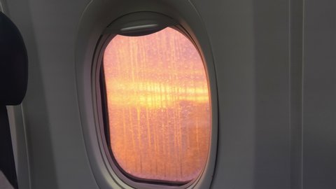 Airplane window in 4k slow motion 60fps