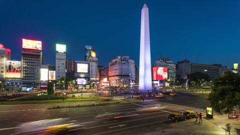Buenos Aires, Argentina - February 03, 2020: Time lapse view of iconic Obelisk of Buenos Aires and traffic on 9 de Julio Ave at dusk in Buenos Aires, Argentina, South America. 