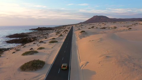 Spain, Canary Islands, Fuerteventura, aerial view of road crossing Corralejo Dunes Natural Park
