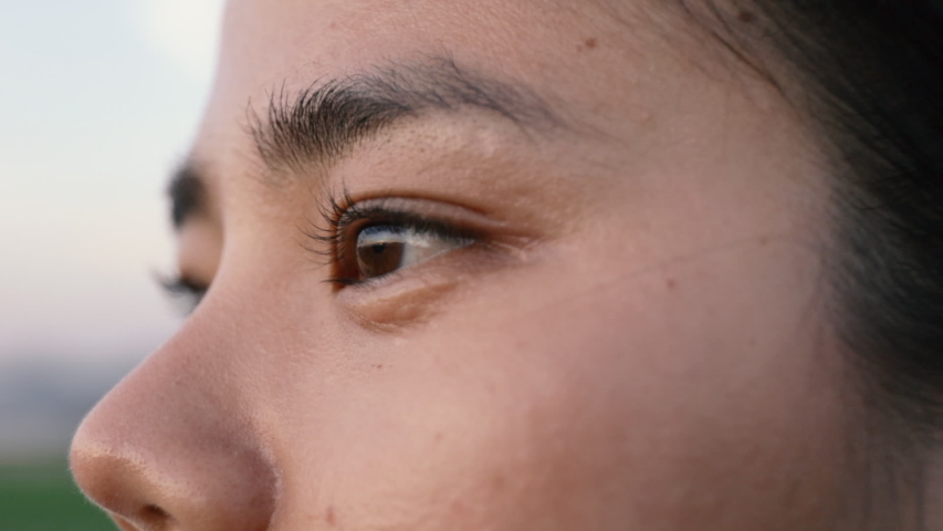 Eyes close up asian woman looking at mountain view after running. | Shutterstock HD Video #1054609274