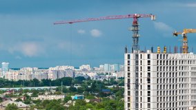 Cityscape time lapse, Large tower cranes build multi-storey buildings. UHD 4K video