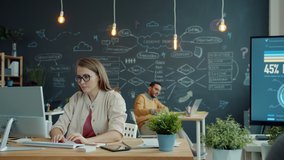 Joyful woman is receiving good news on computer while colleagues multi-ethnci team are applauding in office. People and achievement concept. - Powered by Shutterstock - Get 15% off with code: PIKWIZARD15