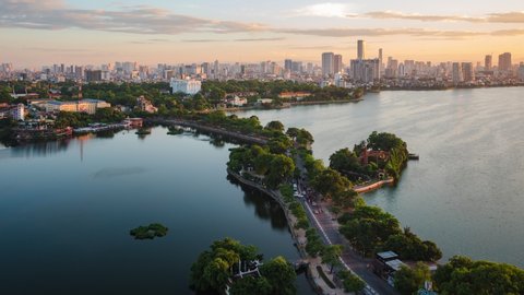 Hanoi, Vietnam, zoom out timelapse view of Hanoi skyline at sunset showing West Lake and Tay Ho District.