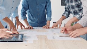 Young Asian business financial team work together in project brainstorm meeting. Cooperate teamwork, strategy planning, small business startup company, or office coworker collaborate concept - Powered by Shutterstock - Get 15% off with code: PIKWIZARD15