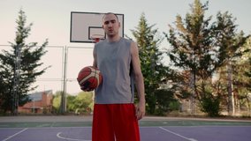 portrait professional basketball 
player, motivational sports video looking at the camera