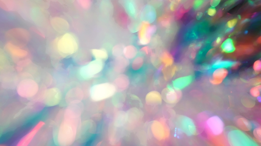 Soft pastel neon pink blue purple silver crystal lights bokeh. Luxury background. Blurred holographic holiday lights. Posterized Abstract Effect