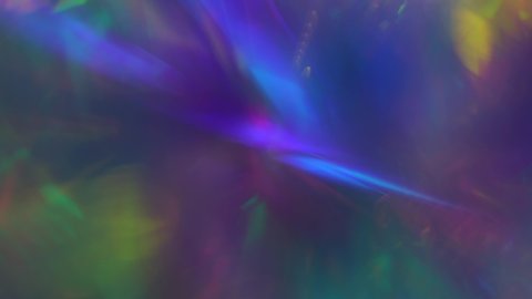 Crystal prism refracting light in vivid rainbow colors. Glass neon purple holographic background. Shake effect