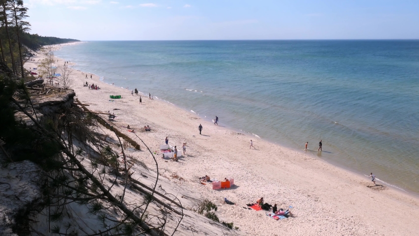 Landscape of Sandy Sea Beach People and Blue and Green Water at Baltic Sea