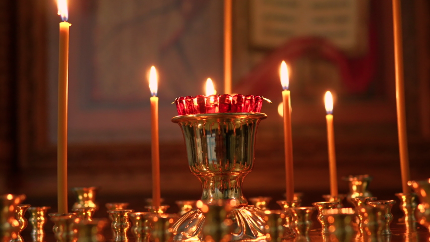 Burning candles in an Orthodox church | Shutterstock HD Video #1054648094