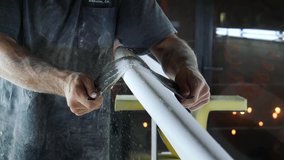 Surfboard making, Shaper is shaving rails on a surfboard. Concept of craftsmanship, small business in America, craftsman at work. - Powered by Shutterstock - Get 15% off with code: PIKWIZARD15