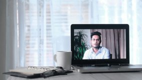 Businessman In a video conference display on laptop screen 