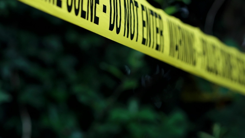 Cinematic Crime Scene Warning Tape, 'Police Crime Scene - Do Not Enter'. Part Of A Murder In The Woods Collection With A Variety Of Camera Angles And Stories. Royalty-Free Stock Footage #1054675064