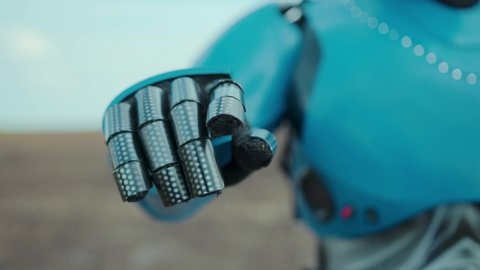 Close-up robot hand touching hologram panel virtual screen technology scanning farm land. Futuristic cyborg robotic worker. Agriculture. Artificial intelligence. Machine learning.