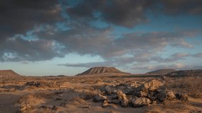 Looping gif video of clouds moving in sky above desert landscape in Fuerteventura, Spain