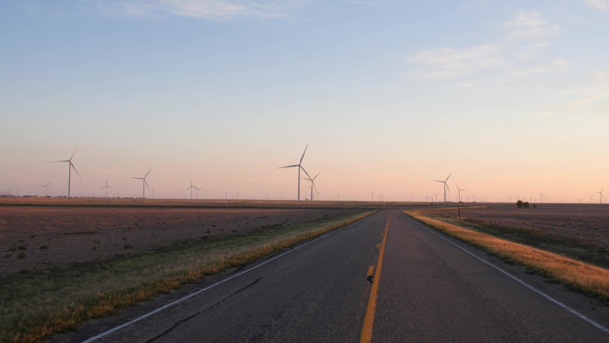 Driving POV through a wind farm in Texas Royalty-Free Stock Footage #1054685492