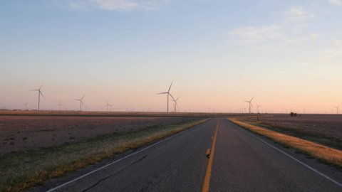 Driving POV through a wind farm in Texas