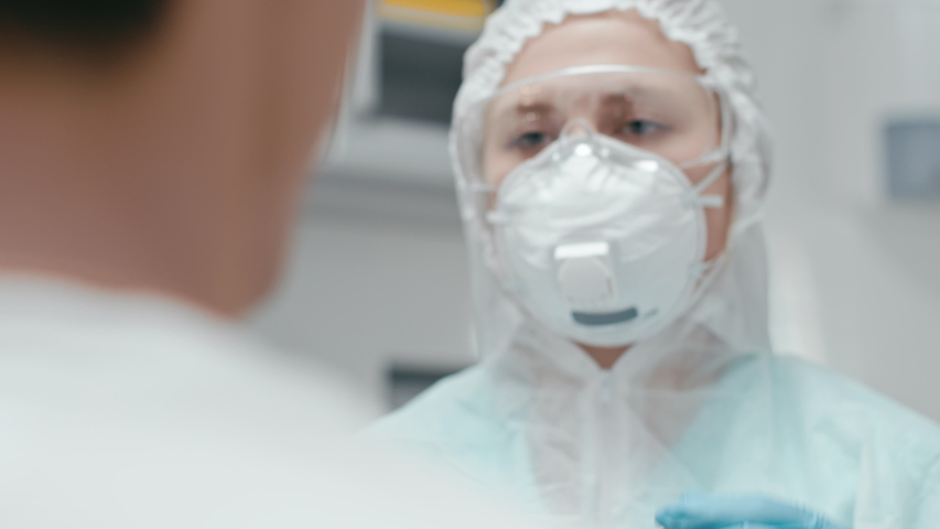 Hospital female employee at laboratory room closeup. PCR sampling for corona virus test by medicine nurse with glasses indoors. Medical equipment for covid-19 sickness cure at doctor scientific office Royalty-Free Stock Footage #1054685687