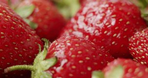 Fresh strawberries, rotating slowly. Close up.