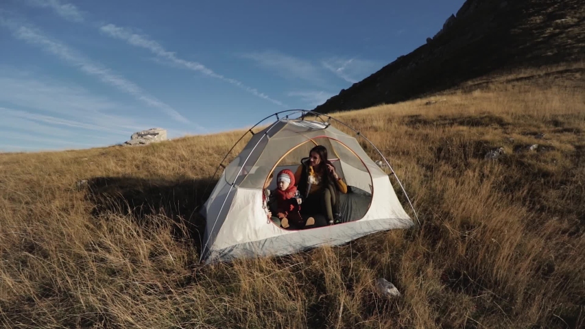 People inside the tent. on a mountainside in Montenegro mooving camera