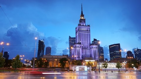 Evening time lapse of Warsaw city downtown in Poland, street traffic and skyline with Palace of Culture and Science.