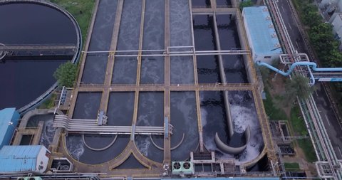Aerial view of big Industrial wastewater cleaning infrastructure in Gujarat, India. Drone view above Water pool tanks station for purified drinking water supply.