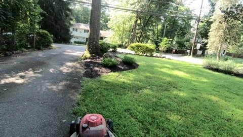 mowing the lawn with lawnmower in summer with sound