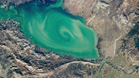 Lake aerial satellite view with scenic water vortex zoom in Lake Skadar Montenegro Europe. Images furnished by Nasa