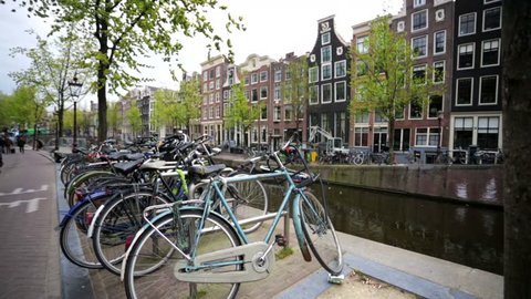 Walk along beautiful street in the central area of Amsterdam. Amsterdam is the most populous city in the Netherlands and its financial, cultural, and creative center.
