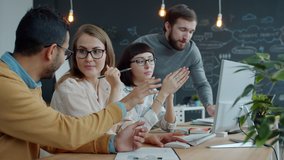 Slow motion of young men and women brainstorming speaking about business in shared office sharing ideas. Communication and businesspeople concept. - Powered by Shutterstock - Get 15% off with code: PIKWIZARD15