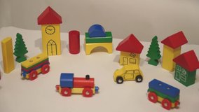 HD Stop Motion footage video of colorful and vibrant train, car and city wooden toy in action and simulation of crashing accident.