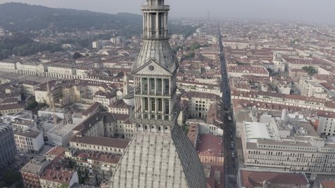 D-Log. Turin, Italy. Flight over the city. Mole Antonelliana - a 19th-century building with a 121 m high dome and a spire, Aerial View, Point of interest