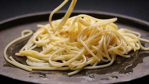 Spaghetti falling in slow motion