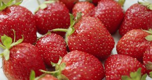 Fresh strawberries, rotating slowly. rotate shot white backgraund